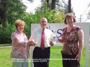 Shrewsbury Women's Club members Joan Frissora and Lynn DeSmet present a check to Tom Kennedy of Shrewsbury Youth and Family Services, Inc.