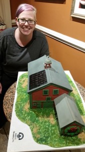 Pastry chef Mara Mahoney with the gingerbread barn