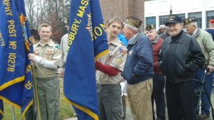 Troop 4 Scouts Ben Collins and Alex Pellizzari hold the flags for the color guard next to veterans at Shrewsbury’s Veterans Day ceremony. (Photo/submitted)