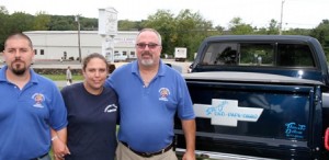(left to right) Dan and Shelly Travers and Fraternal Order of the Eagles #4541 President Steve McDuff stand in front of Shelley's truck that has a memorial on it in honor of her late father, Donald P. Doherty. 