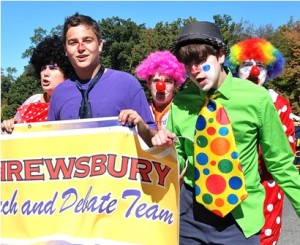 Members of the Shrewsbury High School Speech and Debate Team add character to the parade.