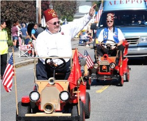 The Worcester County Shrine Club rides its fire brigade on Maple Street.