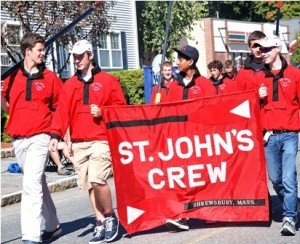 Members of the St. John's crew team marches together.