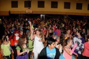 The gymnasium was filled with students enjoying the evening's entertainment.