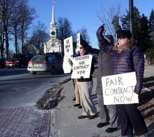 A small group of Shrewsbury teachers protest Wednesday near the public library. Photo/John Swinconeck  