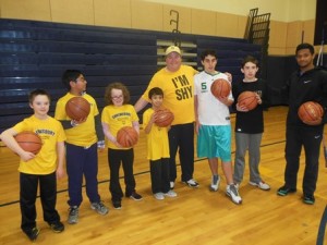 Players and helpers with coach Dan McGinnis (center)