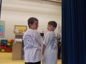 Alex DeLuca and Jared Antoine show off T-shirts displaying the Annie E. Fales Elementary School logo, 