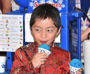 Second-grader Miles Gao samples a snow cone.