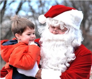 Nate Herold, 4, gets a lift from Santa.