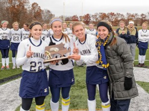 Shrewsbury High School field hockey captains (l to r) Alanna Maniatis (#22), Devan Michael (#19), Christa Doiron (#5) and Justine Sheehan are all smiles with their 2013 Central Mass Division 1 championship trophy.  Shrewsbury won the district title for the second year in a row and will meet Longmeadow High School in the state semi-final.