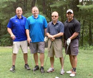 Greg Tresaloni (left) and colleagues at Panera Bread participate in last year’s golf tournament to benefit the Boys & Girls Clubs of MetroWest. Photo/submitted