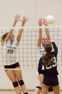 Algonquin juniors Nicole Winkler (left) and Krista Leach attempt to block a shot by Milford’s Ally Zagami. (Photos/Jeff Slovin)