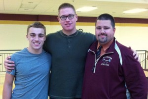 (l to r) Algonquin football players Eric Sweeter and Trevor Fuce with Coach Justin McKay. (Photo/submitted)