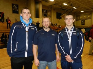 Wrestlers Derek Yanchewski (left) of Maynard and John Cone (right) of Northborough with Coach Matt Schiller at the recent MIAA Division 3 tournament in Foxborough. (Photo/submitted)