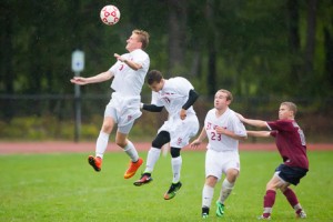 St. John’s Griffith Swedberg (left) leaps up to head the ball in a game against the Westborough Rangers.
