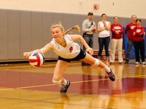 Westborough High School's Tori Flahive strains to reach the ball.