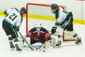 Westborough goalie Jared Ward blocks shots by Wachusett’s Tanyon Ventres (#21, left) and Paul Happy (#14, right).