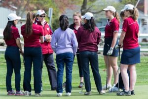 Westborough Coach Sandra Robichaud is giving her team a pep talk before teeing off.