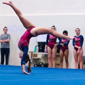 Westborough's Chloe Smith performs a back walkover during her floor performance. 