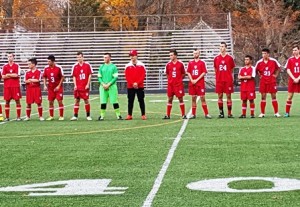 The Hudson boys' soccer team lines up prior to the start of the game. 