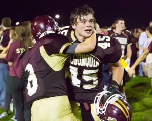 Algonquin’s Michael Stanwood receives a congratulatory hug from a teammate after the victory over North Middlesex.