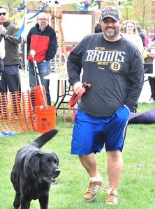 Mike Shannon leads his English Labrador, Wally, to claim the Best Tail Wag prize.
