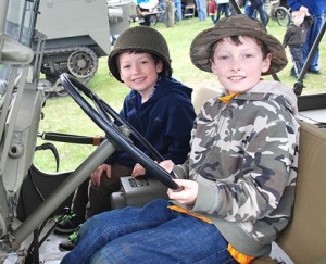 Hunter Miller, 6, and his brother, Conner, 10, take the seat of a 1942 MB jeep.