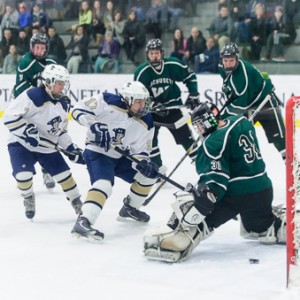 Shrewsbury High School's Tyler O'Keefe (#17, front center) watches his shot trickle past Wachusett Regional High School goalie Jake Strasser for the first score of the game with 0:58 seconds remaining in the first period.  Shrewsbury's Trevor Shea (#7, left), was credited with the assist.  Wachusett players  Dan Bates (#3, left), Jack Watkins (#13, center) and Marc Happy (#8, right) are in the background.