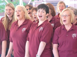 Members of the Westborough Community Chorus sing an upbeat song.
