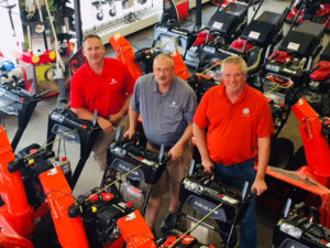 (l to r) Salesmen at Boston Lawnmower Company Rick Simonovitch, Garrett Baker and Peter Fenlason, are shown with some of the Ariens Snow Thrower lineup.