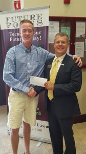 Westborough graduate Connor Fitzgerald (left) accepts his scholarship award from Central One Westborough Branch Manager David Kaiser. (Photo/submitted)