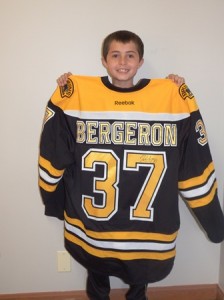 Colin Barr shows off the Patrice Bergeron shirt he won at the Boston Bruins April 12 game against the Buffalo Sabres.  photo/Bonnie Adams 