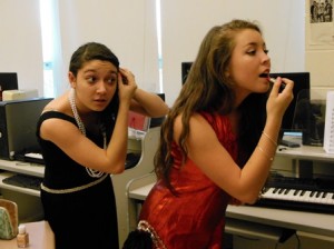 WHS students Paulina McGrath and Sabrina Herstedt put on their make-up for the dress rehearsal. 