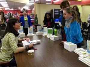 Davies signs books and chats with her fans, asking them about school and their other favorite books. (Photo/Monica Busch)