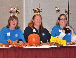 The Fales Elementary School Teachers teammates (l to r) Kate Finn, Jennifer Quinlan-Flynn and Kathy Swanson wear “bee-utiful” headgear.