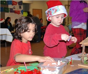 Jeremy Wickremeratne, 7, and Logan McKenney, 3, prepare for Advent by making ornaments. 