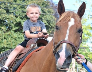 Cameron Glennon, 4, rides a pony.