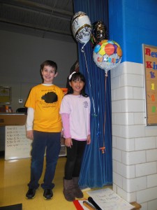 Third-graders Crandall and Estella Yan, get into the spirit of the day's celebration. (Photo/submitted)