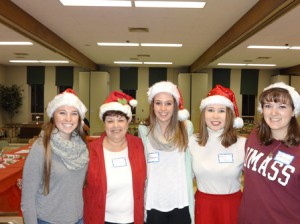 Gloria Josephs with youth group members (l to r) Sarah Connors, Shannon Connors, Addie Egan and Jessica Orlando celebrating Christmas with residents of The Bridge Home at their Christmas party. (Photo/submitted)