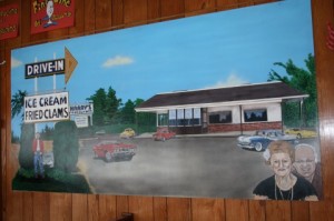 A painting of Harry’s Restaurant with Eleanor and Harry on the bottom right