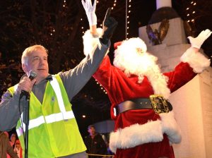 Rotary Club of Westborough President Gerry Gross helps Santa with the tree lighting countdown.