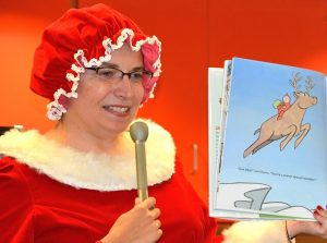 Mrs. Claus reads holiday stories at the Westborough Public Library Children’s Room.