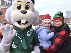 Oakie, the Central One Federal Credit Union mascot, meets Emerson Tumeinski, 4, and her mother Tracy.