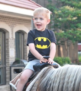 Matthew Peterson, 3, rides a pony.