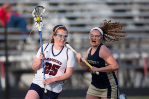 Westborough’s Nicole Foster (#25) looks to pass while being pursued by Shrewsbury’s Madeline Montague