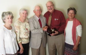 (l to r) Cam Sowa, vice president, PCC; Sharon Miller (Alden’s wife); Alden Miller, retiring board member; Dr. Mark Booher, president; and Mary Taber, executive director. (Photo/Bonnie Adams)