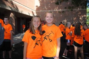 Bethany Woodcock, 10th grade, soccer (left) and Olivia Natale, senior, cross country and indoor/outdoor track pose for a photo. Woodcock will take over the leadership role for this event from Natale next year. 