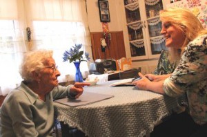 SALMON VNA & Hospice nurse Kathy Schrader shares a laugh with patient Louise Furcinitti in her Milford home. 