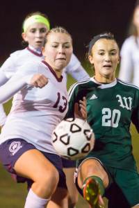 Westborough’s Brittany Los (#13) and Wachusett’s Catherine Elkas (#20) make a play for the ball.