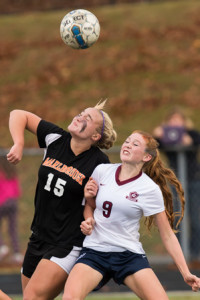 Westborough’s Skyler Barry (#9) and Marlborough’s Hannah Mackay (#15) collide as they prepare to head the ball. 